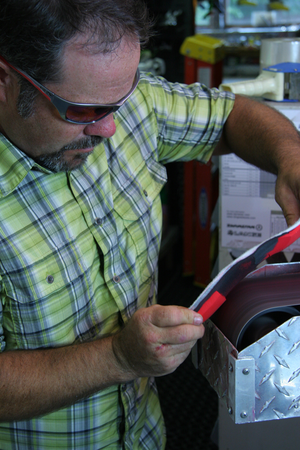 a man making a custom footbed for a pair of ski boots