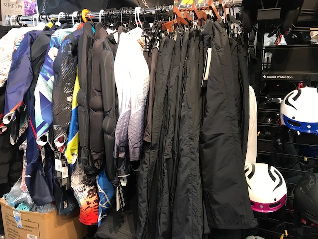winter coats on a clothing rack