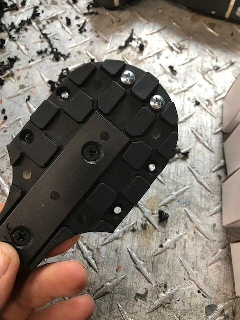 a black boot fitting component